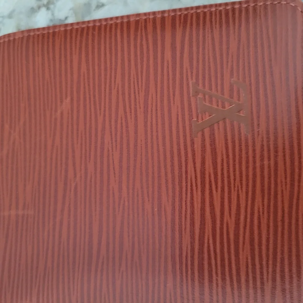 Louis Vuitton Brown Wallet with Elegant Embossed Texture